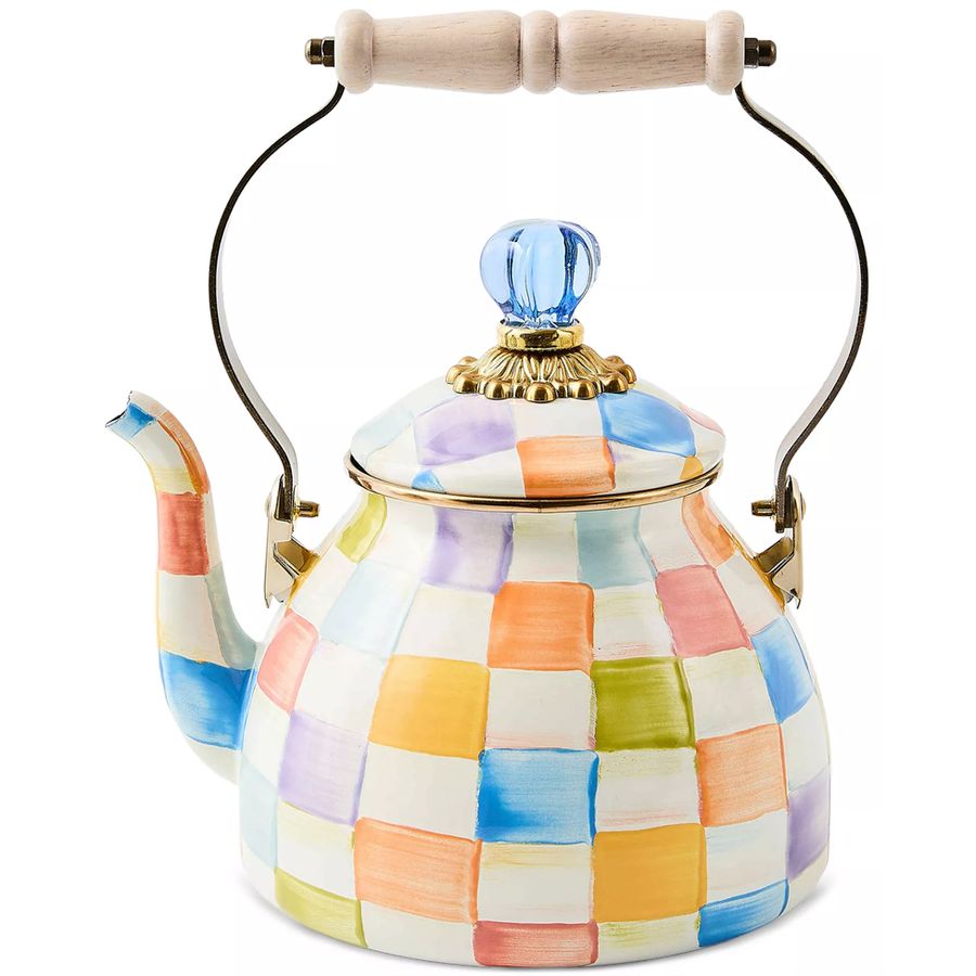 Colorful checkered teapot with wooden handle on a white background