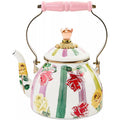 Decorative teapot with floral design and pink handle on a white background