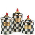 Set of three decorative canisters with checkered pattern and gold accents on a white background