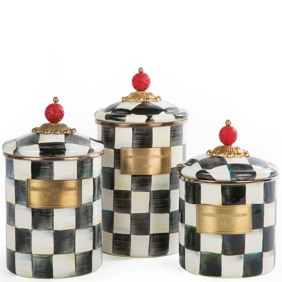 Set of three decorative canisters with checkered pattern and gold accents on a white background