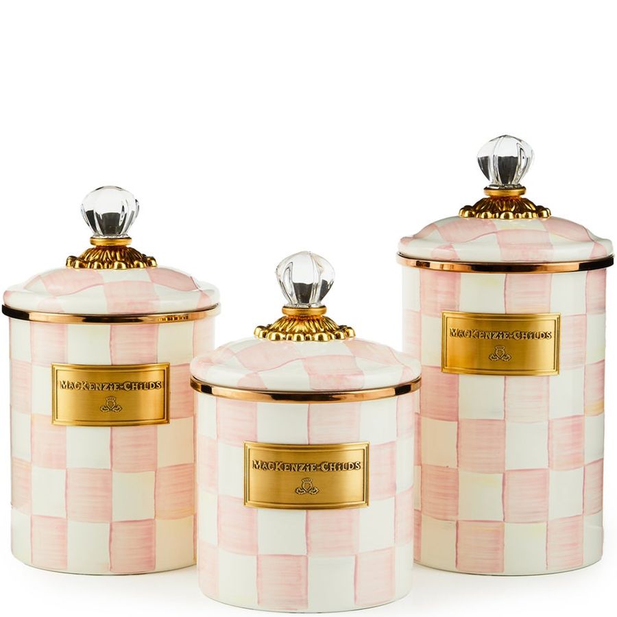 Set of three decorative canisters with checkered pattern and gold accents on a white background