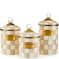 Set of three decorative canisters with checkered pattern and gold accents on a white background