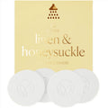 Pack of shower steamers labeled 'linen & honeysuckle' with a brand logo on a beige background.