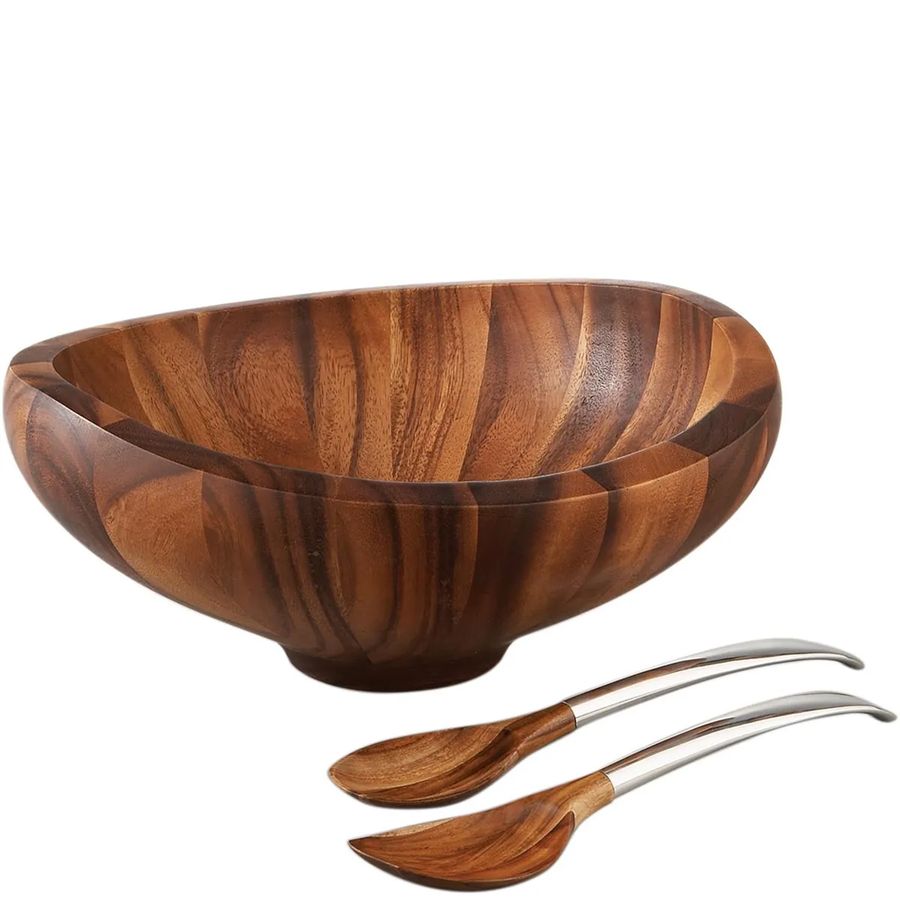 Wooden salad bowl with two wooden spoons on a white background
