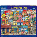 Jigsaw puzzle box featuring a colorful Seaside Village scene with various buildings and people.