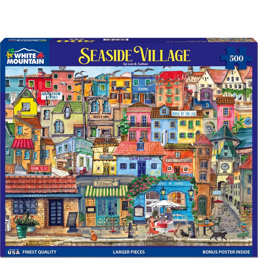 Jigsaw puzzle box featuring a colorful Seaside Village scene with various buildings and people.