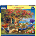 Jigsaw puzzle box featuring a scenic outdoor setting with flowers, furniture, and ocean view.