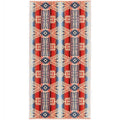Patterned rug with red, blue, and beige colors on a white background