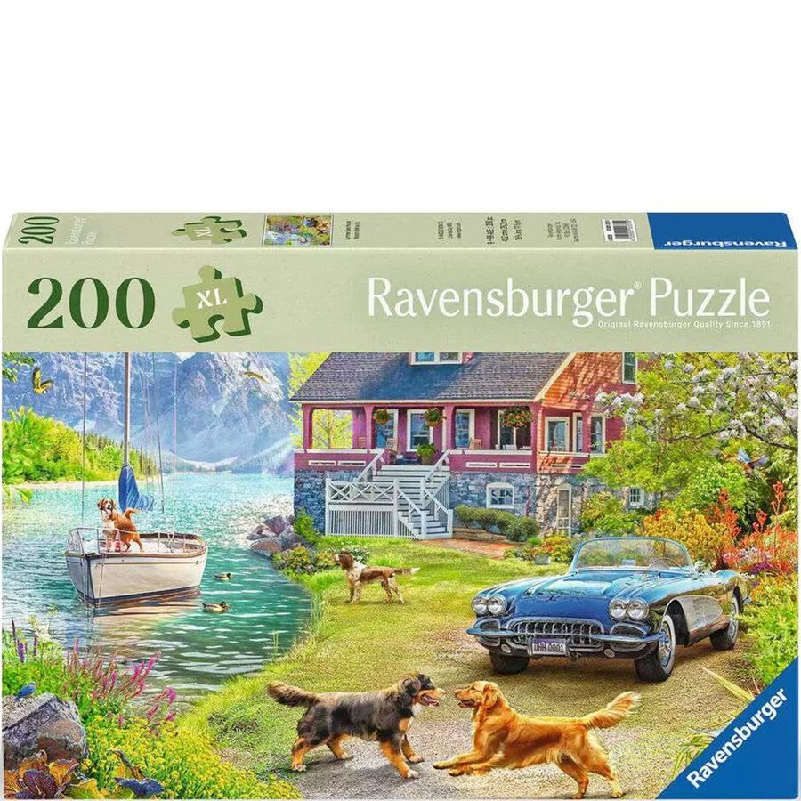 Ravensburger puzzle box with a scenic design featuring a house, boat, and dogs.