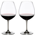 Riedel wine glasses filled with red wine, clear glass, stemware, two glasses side by side.