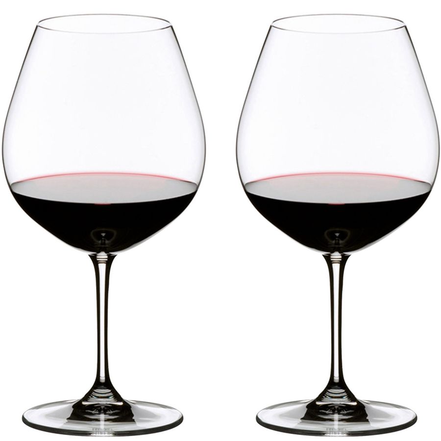 Riedel wine glasses filled with red wine, clear glass, stemware, two glasses side by side.
