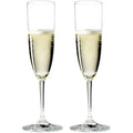Reidel champagne flutes, clear glass, bubbly golden liquid, two identical glasses side by side.