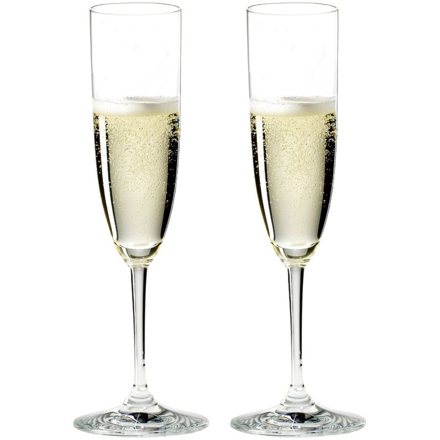 Reidel champagne flutes, clear glass, bubbly golden liquid, two identical glasses side by side.