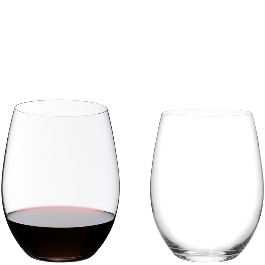 Reidel stemless wine glasses, one with red wine, clear glass, modern design.