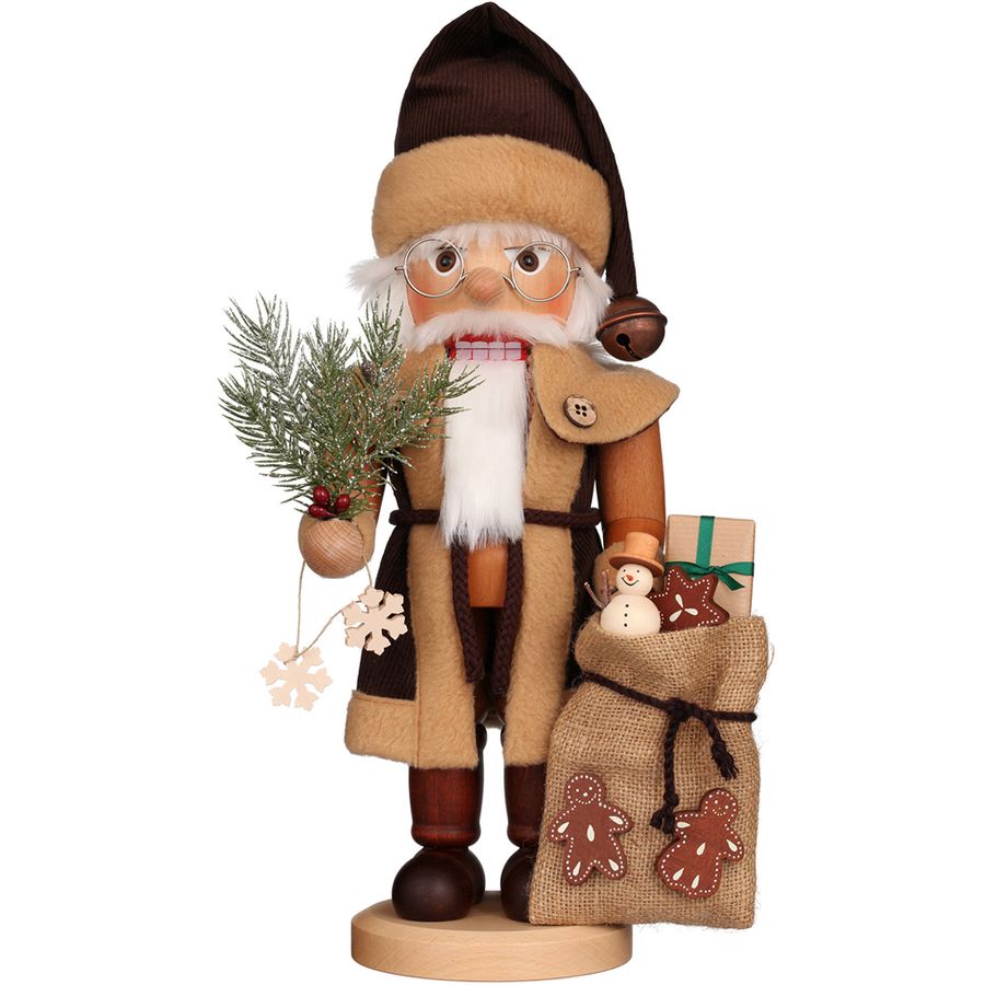 Wooden Santa Claus figurine holding a bag of gifts and a branch on a white background