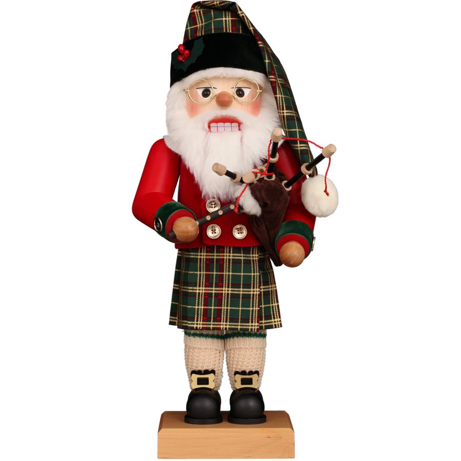 Traditional Scottish Santa Claus figurine with a kilt and bagpipes on a white background