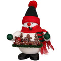 Decorative snowman figurine with a red hat, scarf, and holding gingerbread cookies on a white background