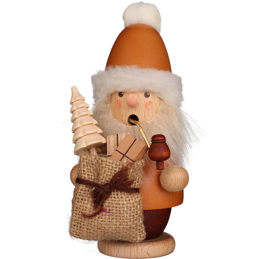 Wooden Santa Claus figurine with a bag, tree, and pipe on a white background