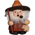 Wooden gnome figurine with a hat, pipe, and shepherd's crook on a white background