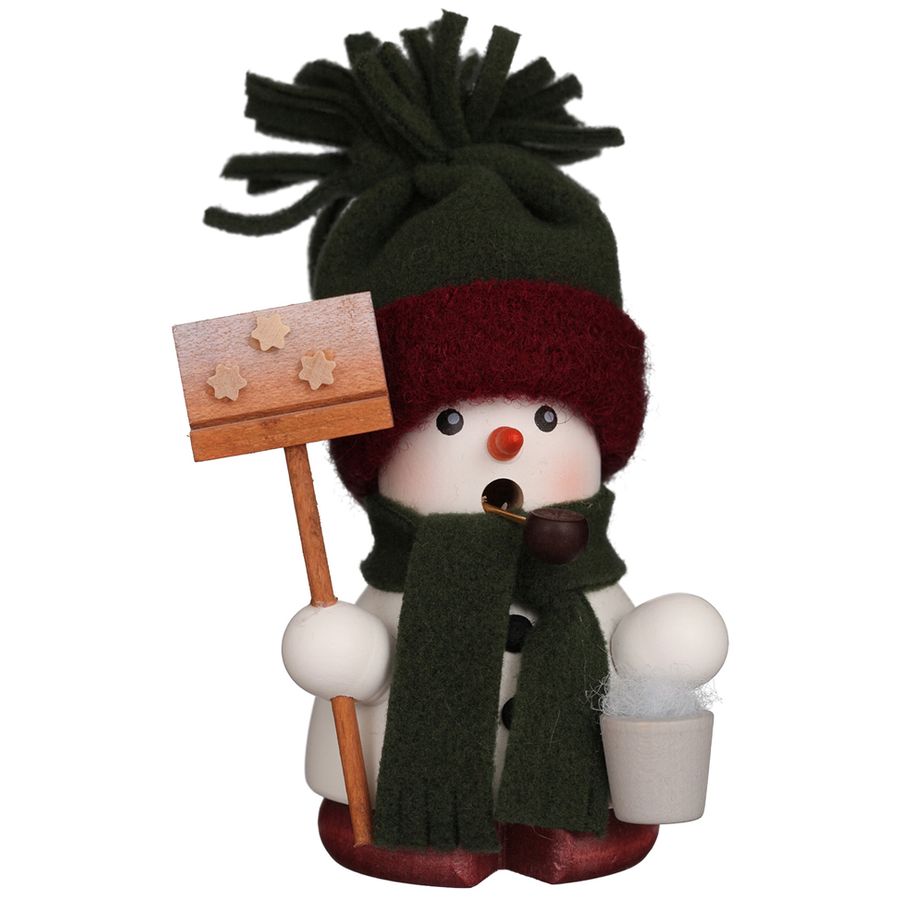 Snowman figurine with a green hat, scarf, and sign on a white background