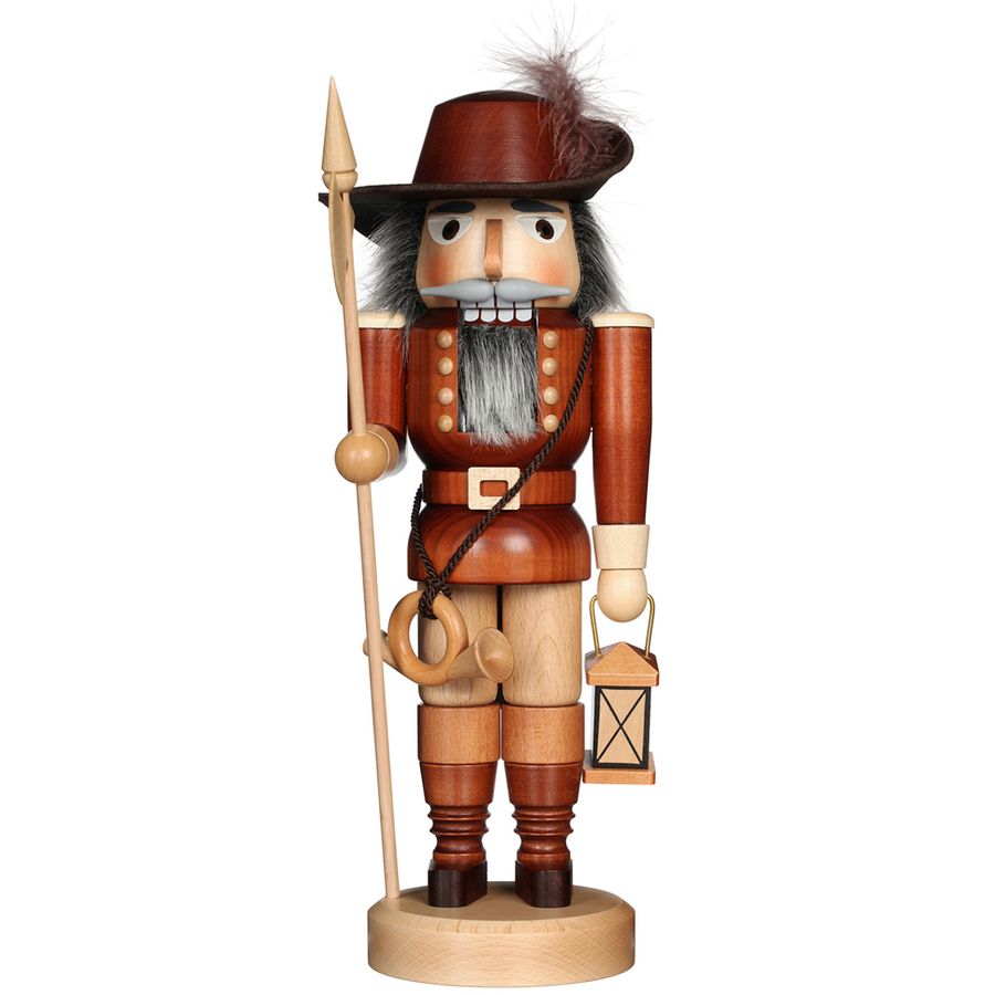 Wooden nutcracker figurine with a hat, spear, and lantern on a white background