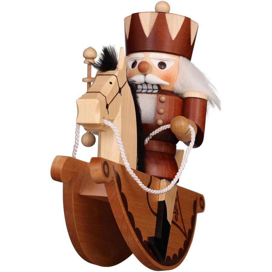 Wooden figurine of a traditional Bavarian man with a hat and a mug on a white background