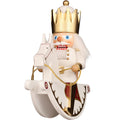 Wooden nutcracker figure of a king with a crown on a white background