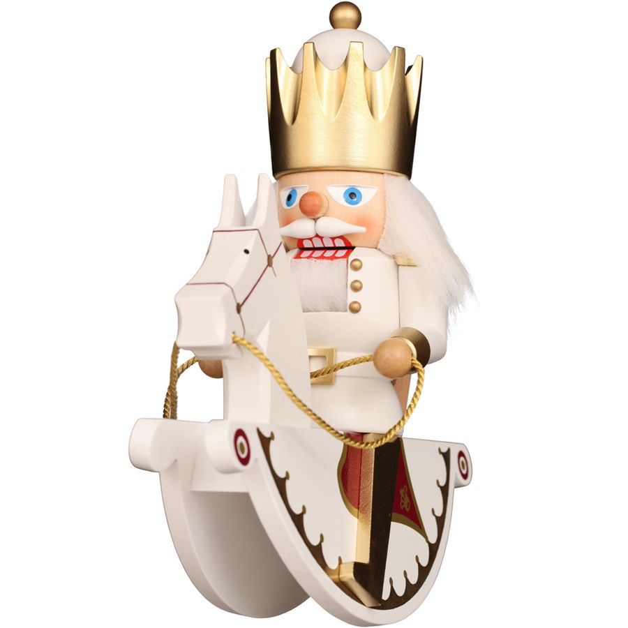 Wooden nutcracker figure of a king with a crown on a white background