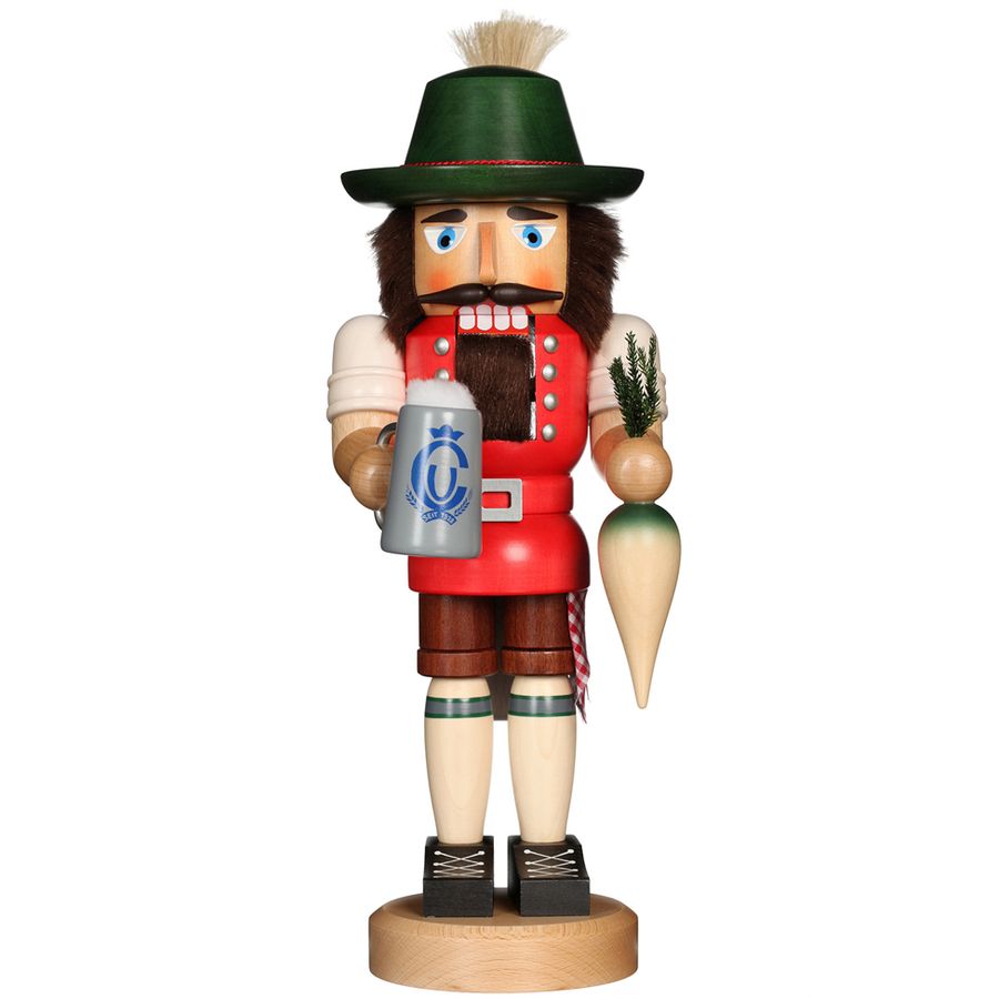 Wooden nutcracker figure in traditional German outfit with a beer mug and carrot, on a white background.