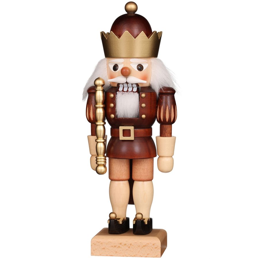 Wooden nutcracker figurine with a crown on a white background