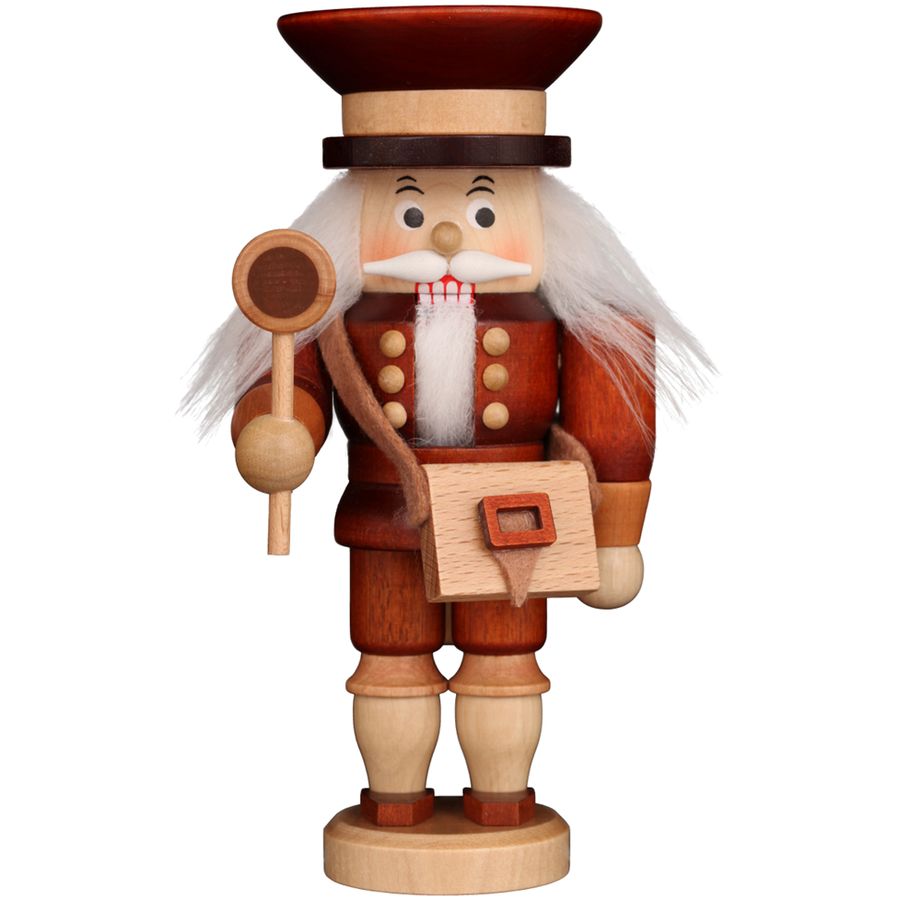Wooden nutcracker figure with a hat, beard, and holding a mace on a white background