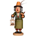 Wooden figurine of a character with a top hat, birdcage, and birds on a white background