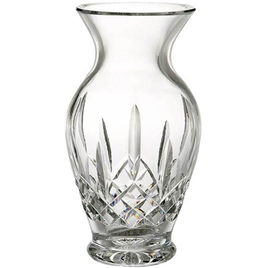 Clear glass vase with intricate cut patterns on a white background