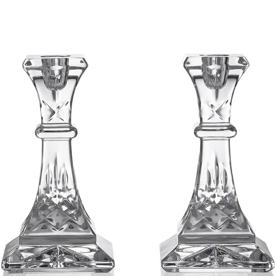 Two crystal candle holders on a white background