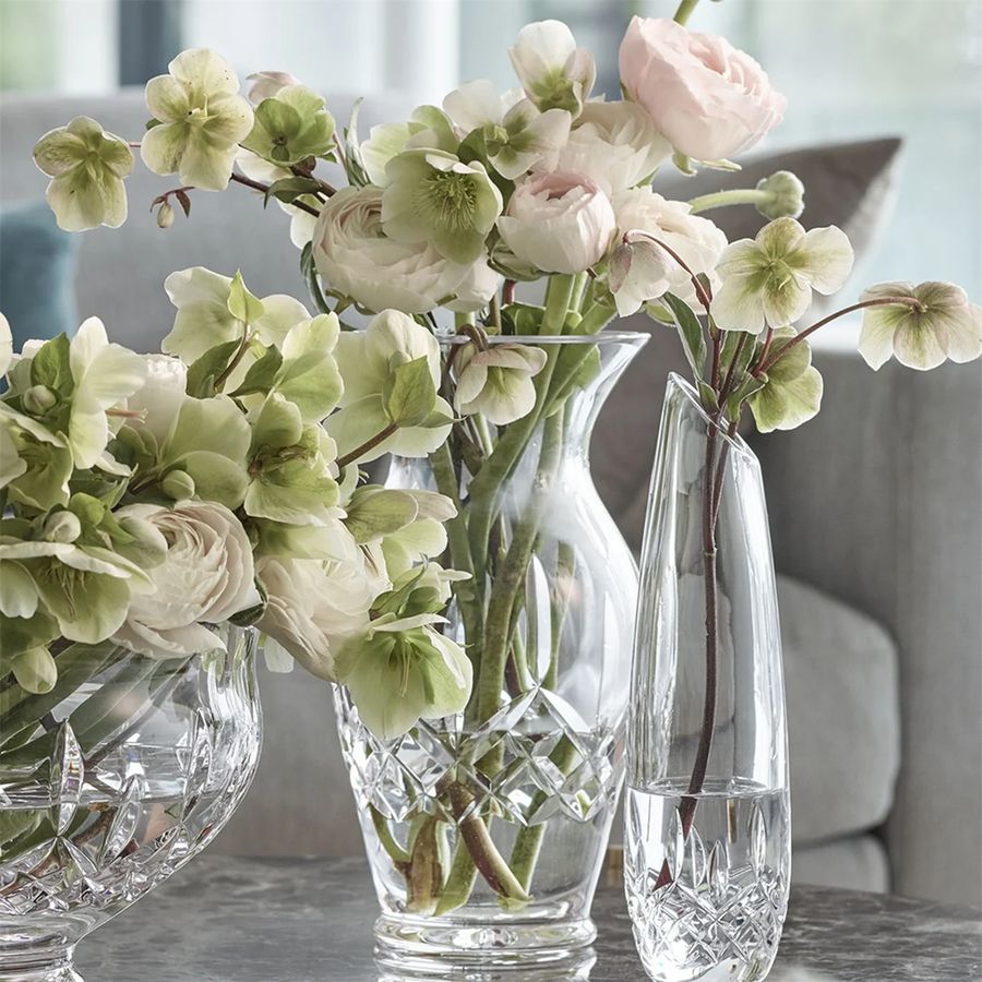 Clear glass vases with flowers on a table
