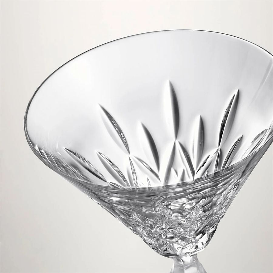 Clear glass with intricate cut patterns on a light gray background