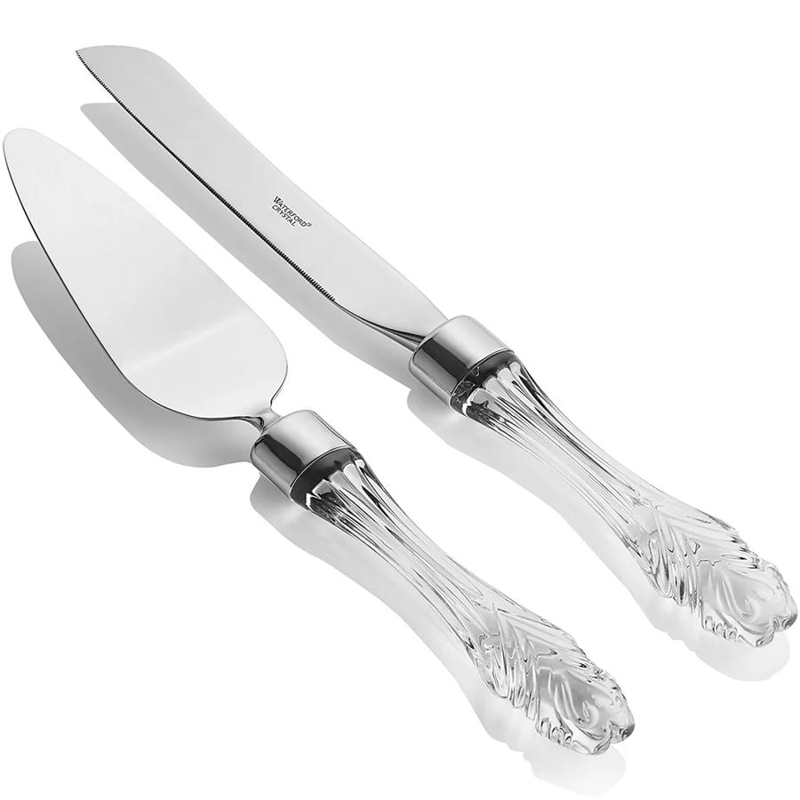 Set of silver cake server and knife with crystal handles on a white background