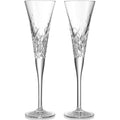 Two crystal champagne flutes on a white background