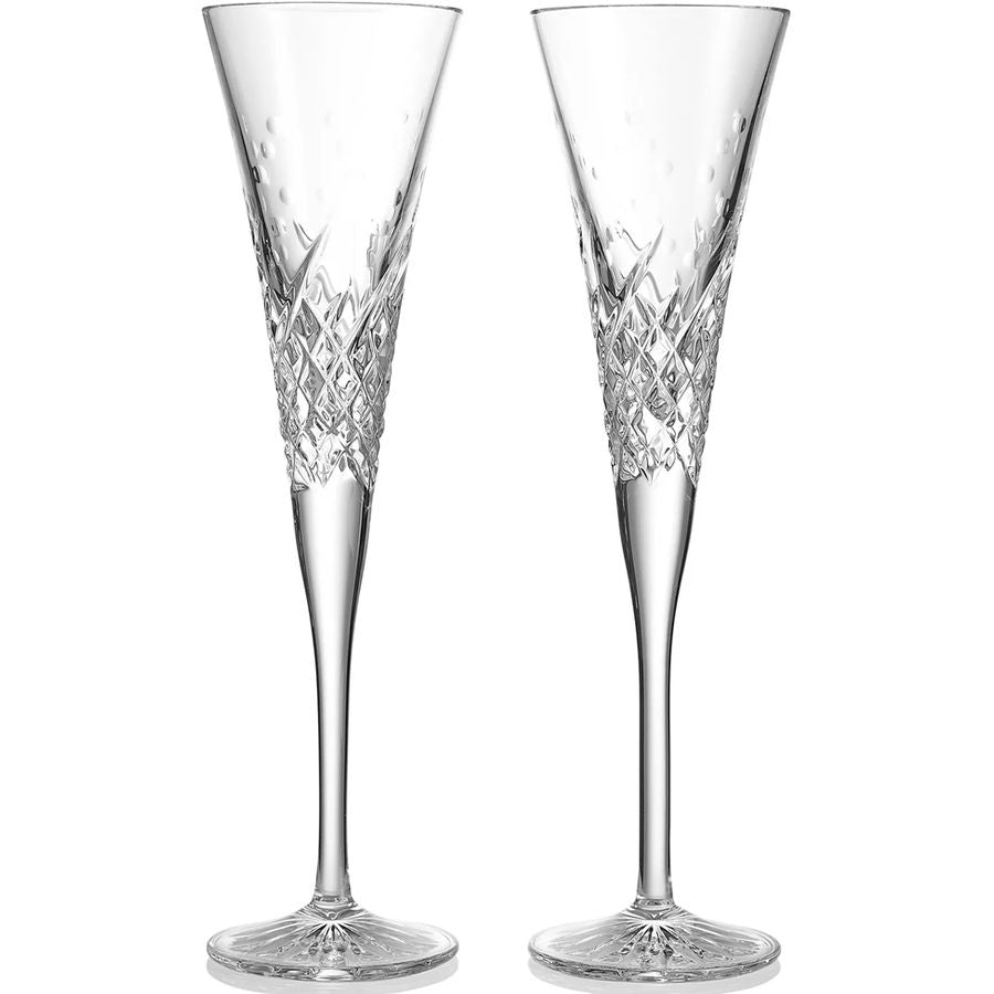 Two crystal champagne flutes on a white background