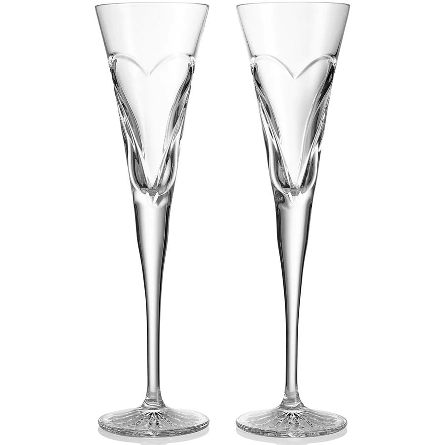 Two clear champagne flutes on a white background